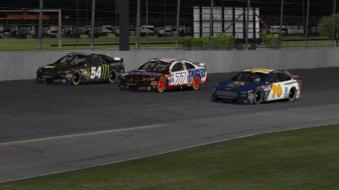 A three-wide battle at 150+ mph with Tim Johnston (#54) and Chad Dalton (#77).
